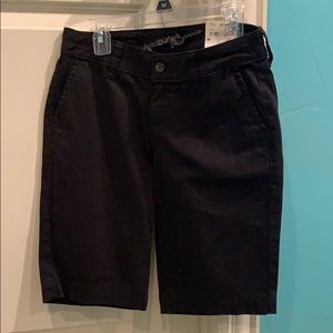 Knee length black shorts